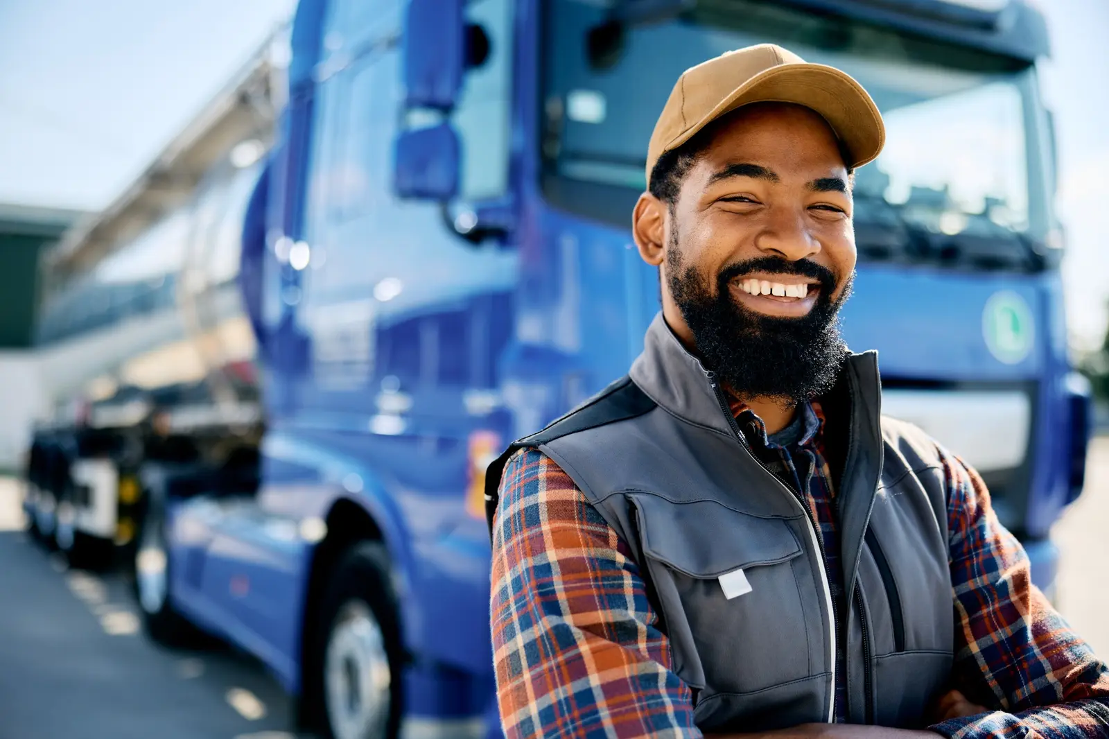 Vantins workers compensation insurance — commercial truck driver beside a fleet vehicle
